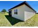 Home backyard featuring a lush lawn and a screened porch at 254 Alford Dr, Davenport, FL 33896