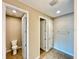Bright bathroom featuring tile floors, a toilet room, and a towel rack at 254 Alford Dr, Davenport, FL 33896