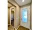 Entryway featuring a decorative glass front door, adjacent to a sidelight window at 254 Alford Dr, Davenport, FL 33896
