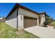 Charming single-story home features an attached two-car garage, well-maintained lawn and landscaping at 254 Alford Dr, Davenport, FL 33896