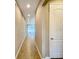 Hallway leads into a living area with lots of natural light at 254 Alford Dr, Davenport, FL 33896