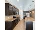 Kitchen featuring dark cabinets, granite countertops, and stainless steel appliances at 254 Alford Dr, Davenport, FL 33896