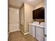 Clean laundry room featuring a washer, dryer, and overhead cabinets for storage at 254 Alford Dr, Davenport, FL 33896