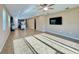 Open-concept living room and kitchen with tile flooring, ample natural light, and modern fixtures at 254 Alford Dr, Davenport, FL 33896