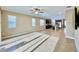Open-concept living room features tile flooring, natural light, and a ceiling fan at 254 Alford Dr, Davenport, FL 33896