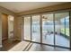 View of the bright patio area with sliding glass doors leading inside at 254 Alford Dr, Davenport, FL 33896