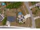 Aerial view of a home with solar panels, a screened-in pool, and spacious yard at 2602 Adelia Blvd, Deltona, FL 32725