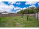 Spacious backyard with wood fence and green grass at 2602 Adelia Blvd, Deltona, FL 32725