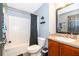 Standard bathroom with a shower-tub combination, modern fixtures, and a wood-style vanity at 2602 Adelia Blvd, Deltona, FL 32725