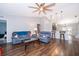 Bright, open living space with hardwood floors, comfortable sofas, and bar stool seating at the breakfast bar at 2602 Adelia Blvd, Deltona, FL 32725