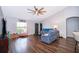 Inviting living room featuring hardwood floors, comfortable seating, and natural light at 2602 Adelia Blvd, Deltona, FL 32725
