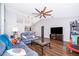 Bright living room with modern ceiling fan, hardwood floors, and comfortable seating at 2602 Adelia Blvd, Deltona, FL 32725