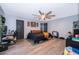 Spacious main bedroom with a modern ceiling fan, closet, and private entrance to the main bath at 2602 Adelia Blvd, Deltona, FL 32725