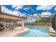 Beautiful screened-in pool area with a covered patio, ideal for outdoor relaxation and entertainment at 2602 Adelia Blvd, Deltona, FL 32725