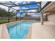 Screened-in pool and patio area perfect for entertaining and relaxation at 2602 Adelia Blvd, Deltona, FL 32725