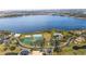 Panoramic aerial view of the community featuring a lake, clubhouse, and recreational facilities at 2602 Shirehall Ln, Winter Garden, FL 34787