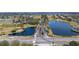 Aerial view showcasing a golf course community with waterways, and lush landscaping at 2602 Shirehall Ln, Winter Garden, FL 34787