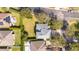 An aerial view of a spacious home with a large green lawn and manicured landscaping at 2602 Shirehall Ln, Winter Garden, FL 34787