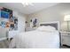 Bedroom featuring white furniture and bright posters on the wall at 2602 Shirehall Ln, Winter Garden, FL 34787
