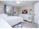 Bedroom with white furniture, TV, ceiling fan, wood-look floors, and window with blinds at 2602 Shirehall Ln, Winter Garden, FL 34787