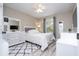 Cozy bedroom with plush rug, white furniture, ceiling fan and window view at 2602 Shirehall Ln, Winter Garden, FL 34787