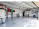 Bright garage with epoxy flooring and storage at 2602 Shirehall Ln, Winter Garden, FL 34787