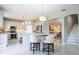 Modern kitchen with marble island, white cabinets, and stainless steel appliances at 2602 Shirehall Ln, Winter Garden, FL 34787