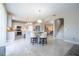 Bright and airy kitchen with a marble island, open layout, and modern lighting at 2602 Shirehall Ln, Winter Garden, FL 34787