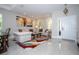 Bright living room with light gray walls, a colorful rug, and contemporary artwork at 2602 Shirehall Ln, Winter Garden, FL 34787