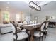 Open-concept living space with dining area, living room, and modern lighting at 2602 Shirehall Ln, Winter Garden, FL 34787