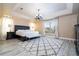 Bright main bedroom with a large window, a plush rug and a comfortable bed at 2602 Shirehall Ln, Winter Garden, FL 34787