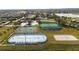 An aerial view of community recreational facilities including a tennis court, and shuffleboard area at 2602 Shirehall Ln, Winter Garden, FL 34787