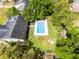 Aerial view of home with a large pool, lush greenery, and a peaceful backyard at 261 West Citrus St, Altamonte Springs, FL 32714