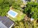 Aerial view of home with a large pool, lush greenery, and a peaceful backyard at 261 West Citrus St, Altamonte Springs, FL 32714