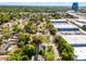 An aerial view displays the property nestled among mature trees in a residential neighborhood at 261 West Citrus St, Altamonte Springs, FL 32714