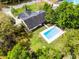 Aerial view of home with a large pool, lush greenery, and a peaceful backyard at 261 West Citrus St, Altamonte Springs, FL 32714