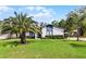 Well-maintained home with lush landscaping, spacious lawns and mature trees, providing a serene living environment at 261 West Citrus St, Altamonte Springs, FL 32714