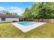 Spacious backyard with an in-ground pool and surrounded by lush green grass at 261 West Citrus St, Altamonte Springs, FL 32714