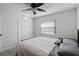 Bedroom with a comfortable bed, ceiling fan, window, and plush toy sitting on the pillows at 261 West Citrus St, Altamonte Springs, FL 32714