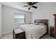 Cozy bedroom with a queen-sized bed, trunk, and a ceiling fan for added comfort at 261 West Citrus St, Altamonte Springs, FL 32714