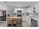 Modern kitchen with stainless steel appliances, an island, white cabinets, and quartz countertops at 261 West Citrus St, Altamonte Springs, FL 32714