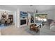 The open living room features a fireplace, neutral color palette, and easy access to the backyard at 261 West Citrus St, Altamonte Springs, FL 32714