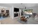 Bright, open living space with fireplace, tile flooring, and seamless flow to dining and outdoor areas at 261 West Citrus St, Altamonte Springs, FL 32714