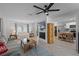 A spacious living room boasts neutral colors, modern fixtures, and easy access to the kitchen at 261 West Citrus St, Altamonte Springs, FL 32714
