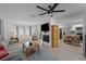 Open-concept living room with tile floors, a fireplace, and plenty of natural light from large windows at 261 West Citrus St, Altamonte Springs, FL 32714