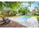 Relaxing pool area surrounded by mature trees at 261 West Citrus St, Altamonte Springs, FL 32714