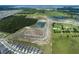 An aerial view of an up and coming neighborhood being constructed near green space and several bodies of water at 2672 Great Heron Ave, St Cloud, FL 34773