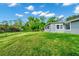 Lush backyard with a well-maintained lawn and views of the home at 275 W 3Rd St, Chuluota, FL 32766