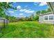 Fenced backyard featuring a well-manicured lawn and mature trees at 275 W 3Rd St, Chuluota, FL 32766