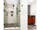 Stunning bathroom featuring a frameless shower with unique tiling and a dark shower head at 275 W 3Rd St, Chuluota, FL 32766